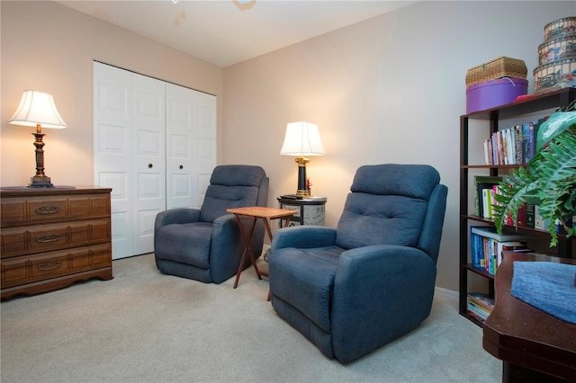 living area featuring light colored carpet