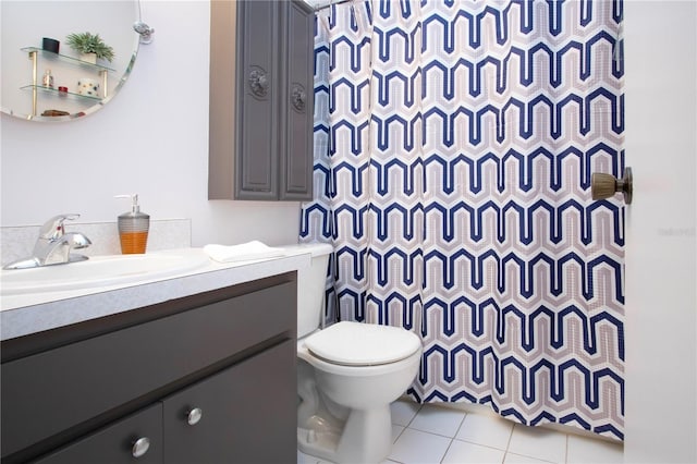 bathroom with walk in shower, tile patterned floors, vanity, and toilet