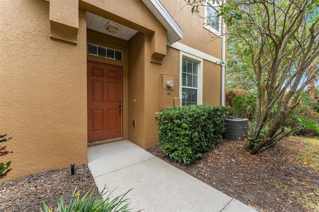 doorway to property featuring cooling unit