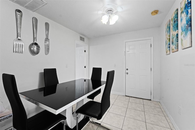 3332 W Heiter St, Tampa, FL 33607 - dining space with light tile patterned floors and baseboards