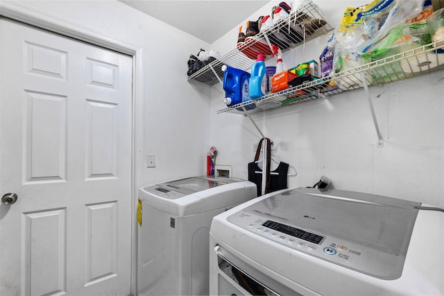 laundry room featuring independent washer and dryer