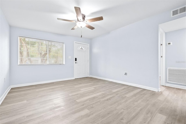 unfurnished room featuring light wood-type flooring and ceiling fan