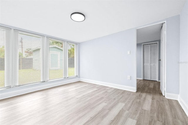 spare room featuring light wood-type flooring