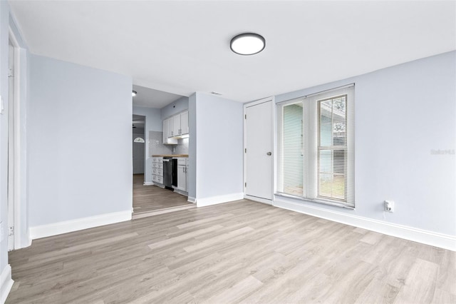 unfurnished living room with light wood-type flooring