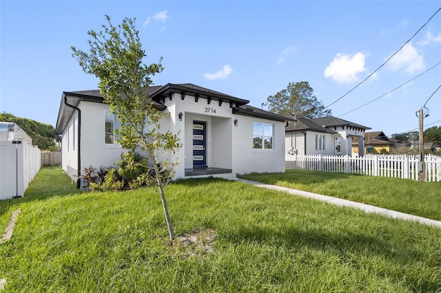 view of front of home with a front lawn