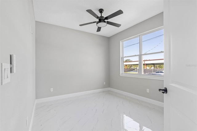 empty room featuring ceiling fan