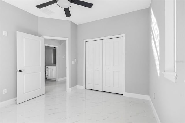 unfurnished bedroom with ceiling fan and a closet