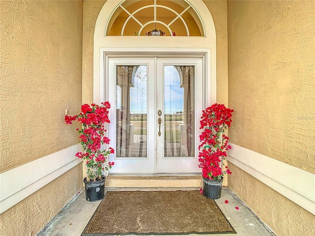 doorway to property featuring french doors