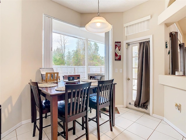 dining space with light tile patterned floors