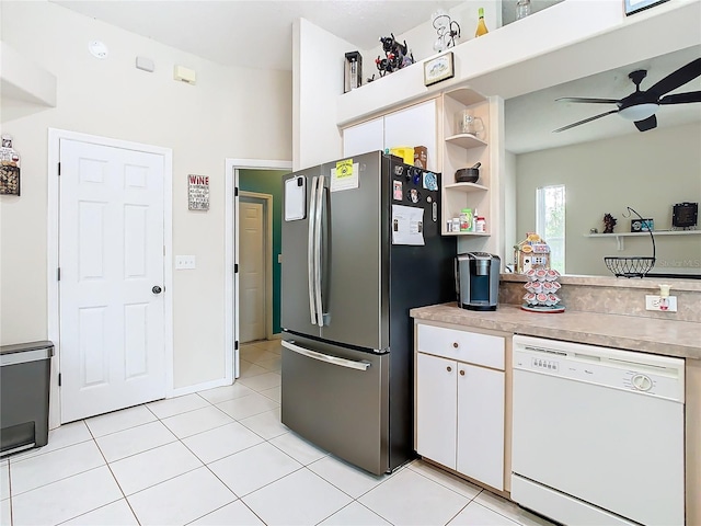 kitchen with ceiling fan, light tile patterned floors, white dishwasher, white cabinets, and stainless steel fridge