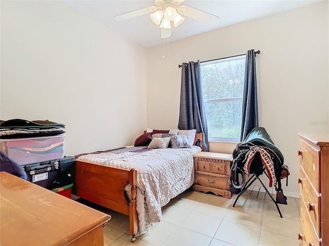 tiled bedroom with ceiling fan