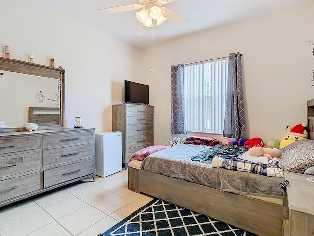 tiled bedroom with ceiling fan