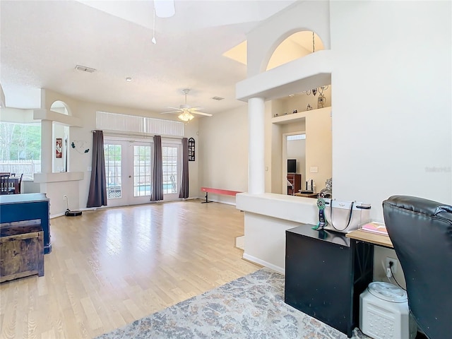 kitchen featuring ceiling fan, light hardwood / wood-style floors, and french doors