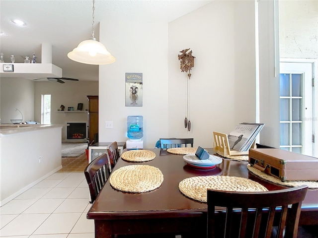 dining space featuring light tile patterned floors