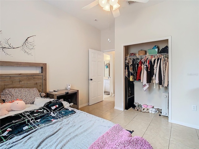 tiled bedroom featuring a closet and ceiling fan