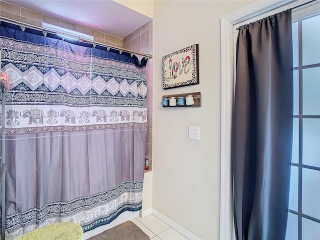 bathroom with walk in shower and tile patterned flooring