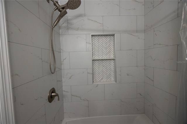 bathroom with tiled shower