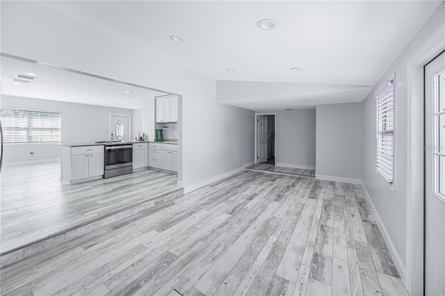 unfurnished living room featuring light hardwood / wood-style flooring