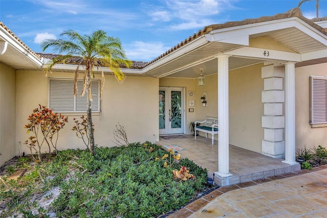 doorway to property featuring french doors and a patio area