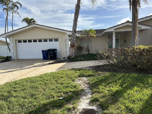 single story home with a front lawn and a garage