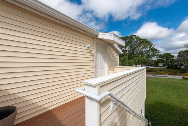 view of side of property with a lawn