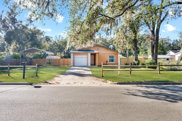 ranch-style home featuring a garage and a front yard