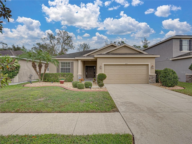 view of front of property featuring a garage and a front yard