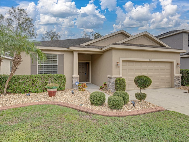 single story home with a garage and a front lawn