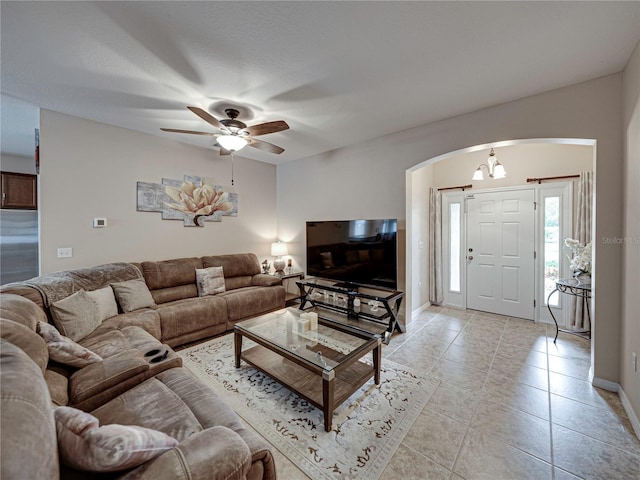 living room featuring light tile patterned floors and ceiling fan