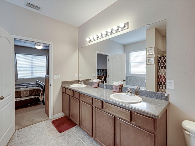 bathroom with vanity, ceiling fan, tile patterned flooring, and a shower with curtain