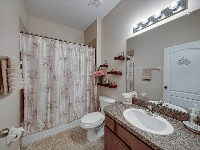 full bathroom featuring shower / bath combo, toilet, tile patterned floors, a textured ceiling, and vanity