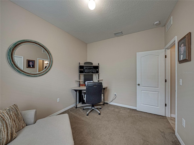 office featuring a textured ceiling and carpet flooring