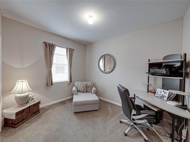 office area with light colored carpet and a textured ceiling