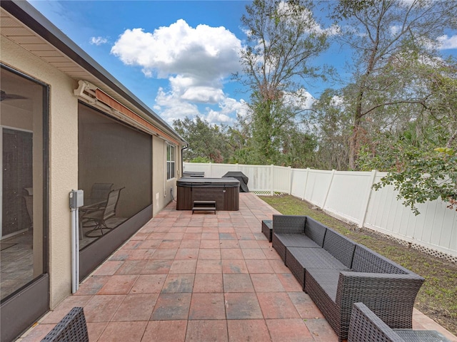 view of patio / terrace featuring a hot tub