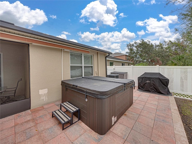 view of patio featuring a hot tub