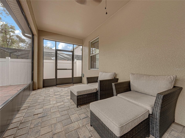 sunroom with ceiling fan