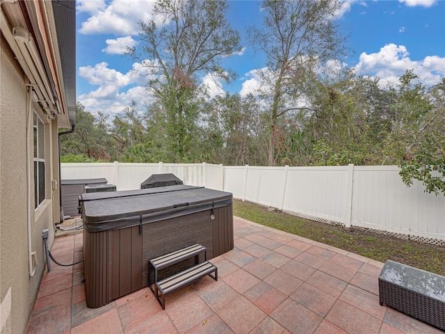 view of patio / terrace featuring a hot tub