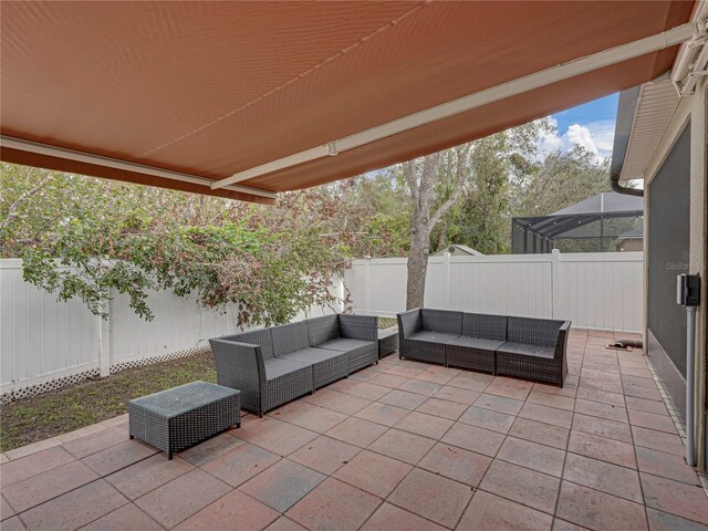 view of patio with a lanai and outdoor lounge area