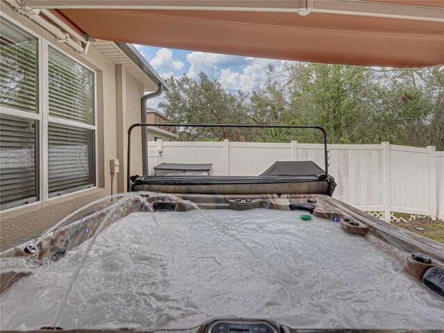 view of patio featuring a hot tub