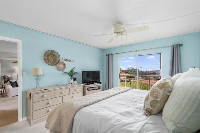 bedroom with access to exterior, a ceiling fan, and light colored carpet