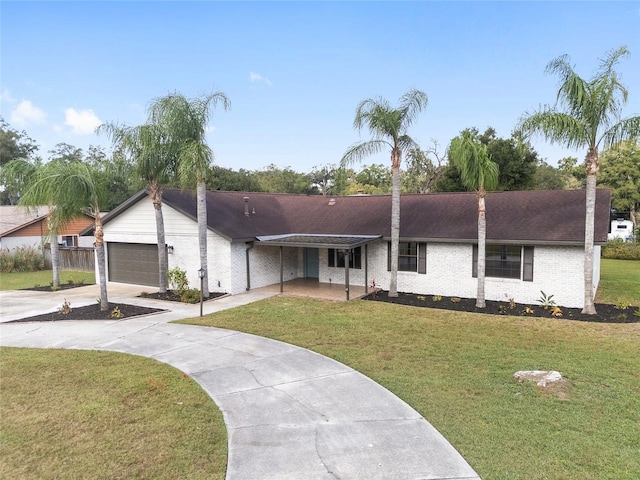 single story home with a garage and a front yard