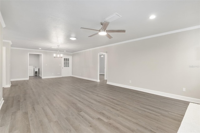 unfurnished living room featuring hardwood / wood-style floors, ceiling fan with notable chandelier, independent washer and dryer, and ornamental molding