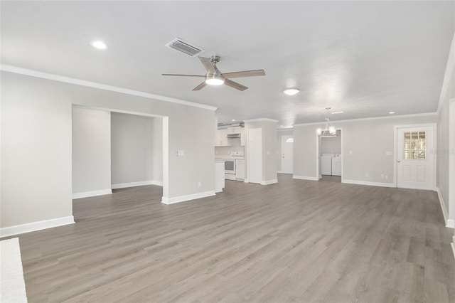 unfurnished living room featuring ceiling fan with notable chandelier, light hardwood / wood-style flooring, and crown molding