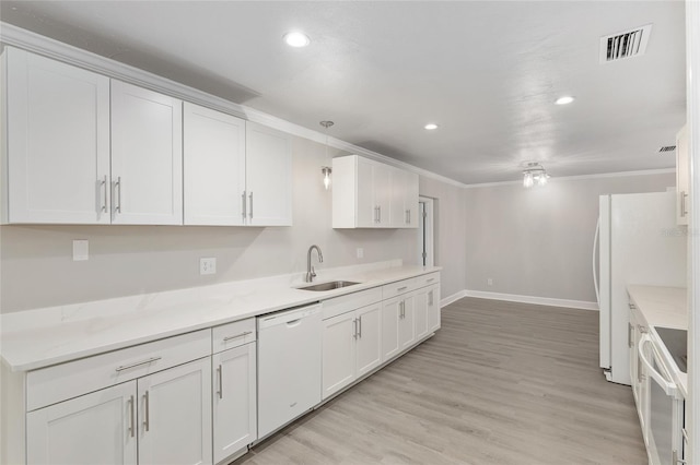 kitchen featuring ornamental molding, white cabinetry, light wood-type flooring, sink, and white appliances