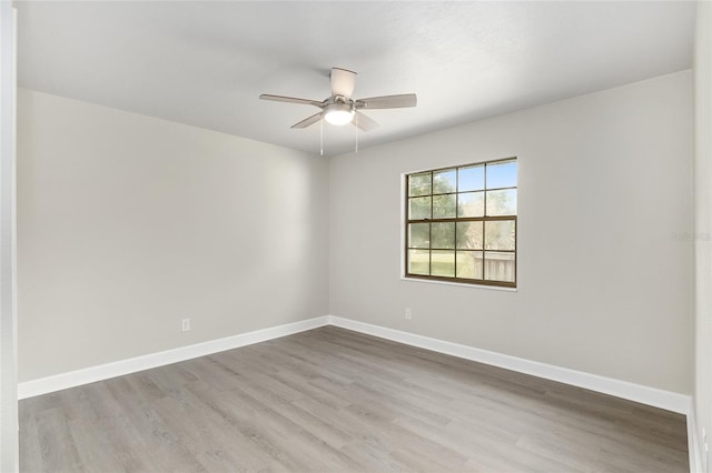 unfurnished room featuring ceiling fan and light wood-type flooring