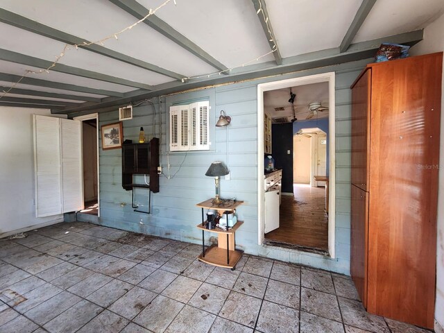 garage with wood walls