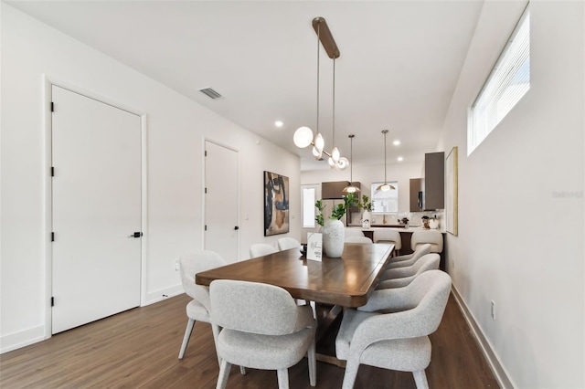 dining room with dark wood-type flooring