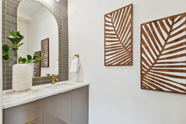 bathroom with vanity and backsplash