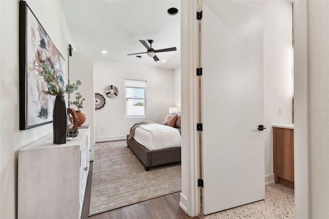 bedroom featuring light hardwood / wood-style floors and ceiling fan