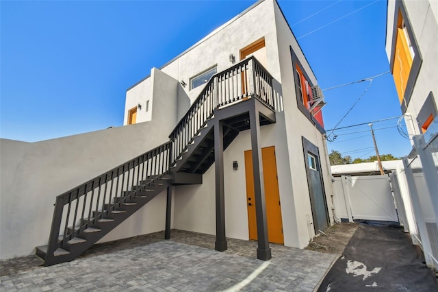 view of side of property featuring a patio area